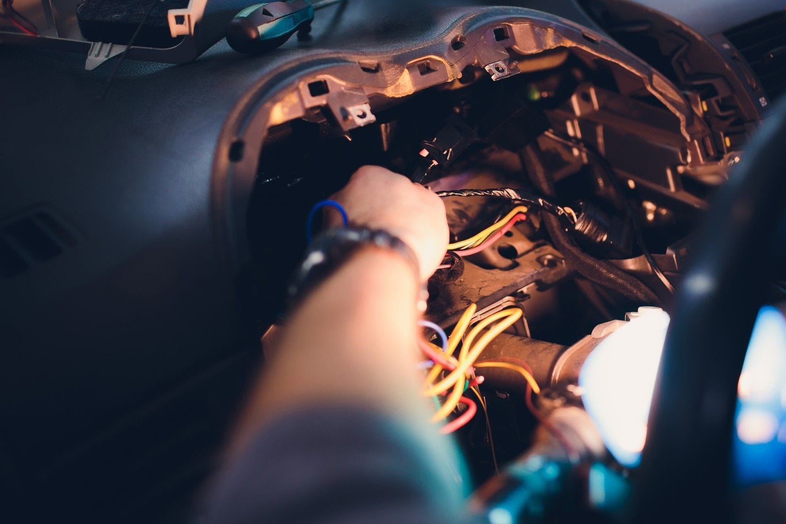 Mechanic repairing the cars electronics