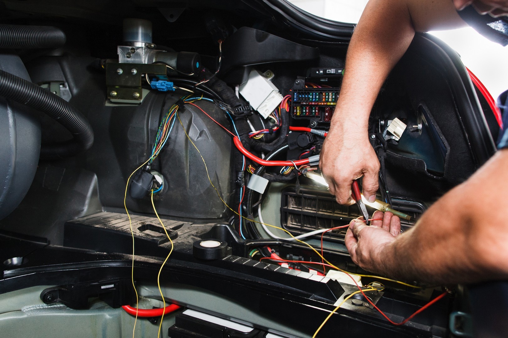 Technician Fixing The Cars Electronics